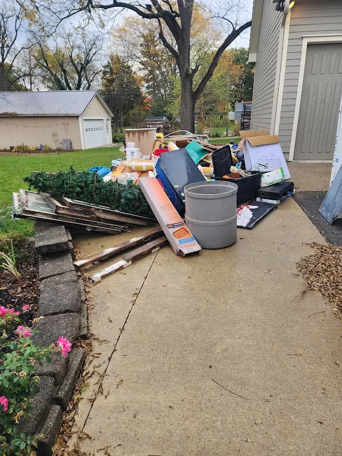 Dumpster being loaded with debris for 10 Yard Dumpster Rental in South San Gabriel